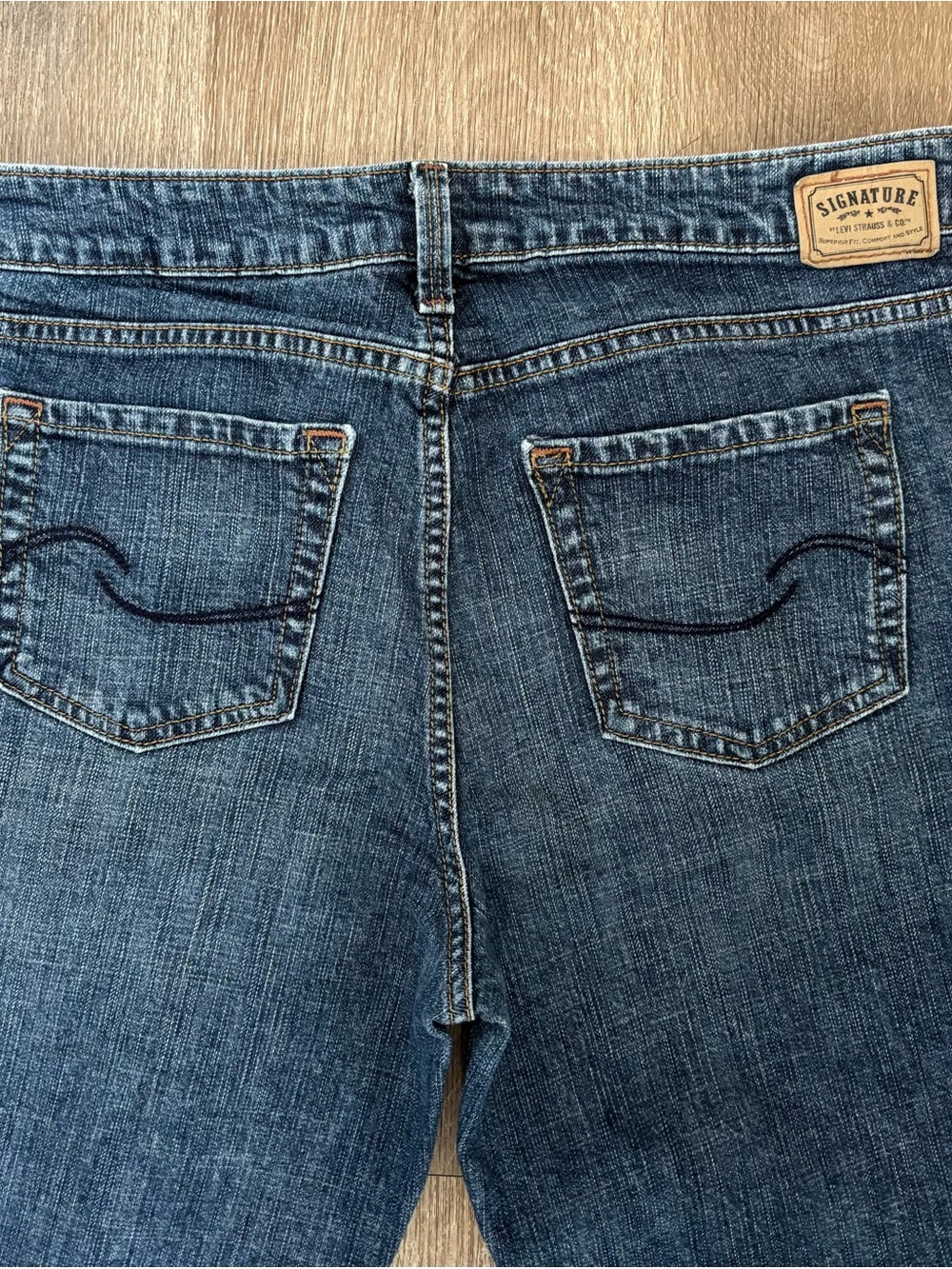 Signature Distressed Blue Denim Jeans with Back Pocket Wave Stitch
